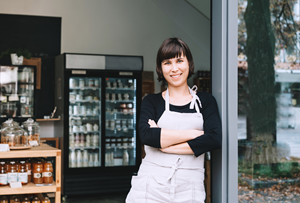 business owner standing outside shop